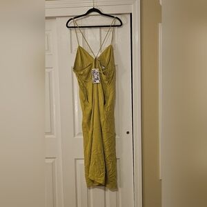 Neon green maxi dress with pockets and front cutout from the Future Collection